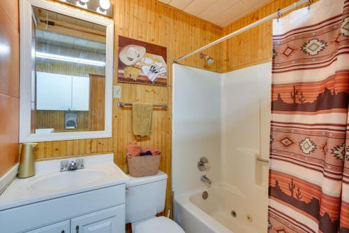 a bathroom with a sink and a toilet and a shower at Green Valley Vacation Rental Apt with Patio and Grill! in Green Valley
