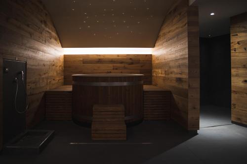 a sauna with a bench in a room with wooden walls at Lake Hotel La Pieve in Pisogne