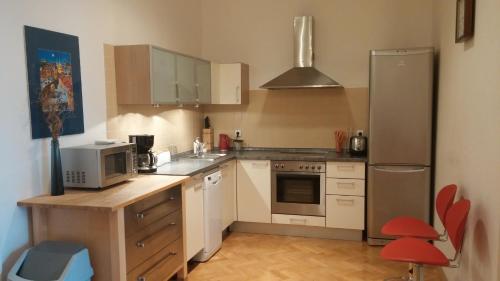 Kuchyň nebo kuchyňský kout v ubytování Apartment Balbínova
