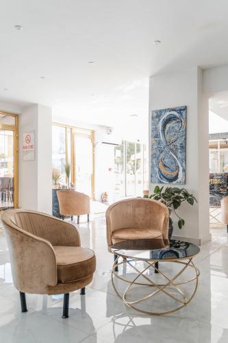 a lobby with two chairs and a table at Far Life Hotel in Antalya
