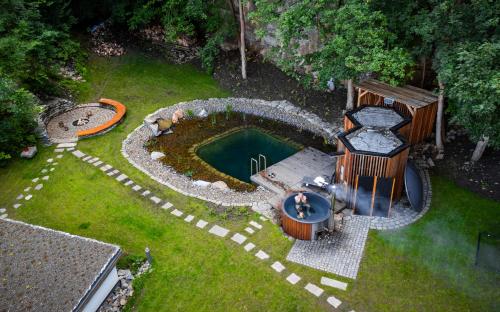 an aerial view of a swimming pool in a yard at Apartmány NONE in Branná