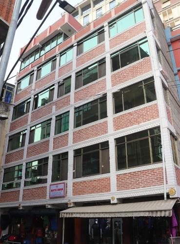 a tall brick building with a store in front of it at Hotel Hana Pvt.Ltd in Kathmandu