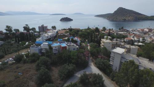 an aerial view of a city and the water at Heliotopos Apartments in Tolo