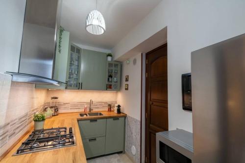a kitchen with a sink and a stove top oven at The Cyclops Retreat - Seaview in Aci Castello