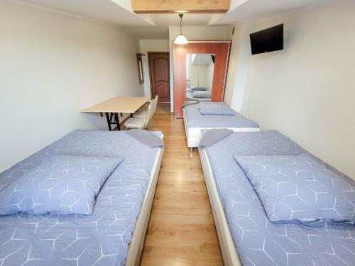 Ένα ή περισσότερα κρεβάτια σε δωμάτιο στο Hotel Ambrozja