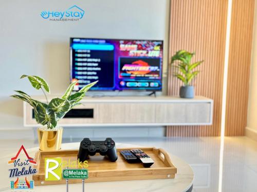 Televisyen dan/atau pusat hiburan di Bali Residence Melaka By Heystay Management