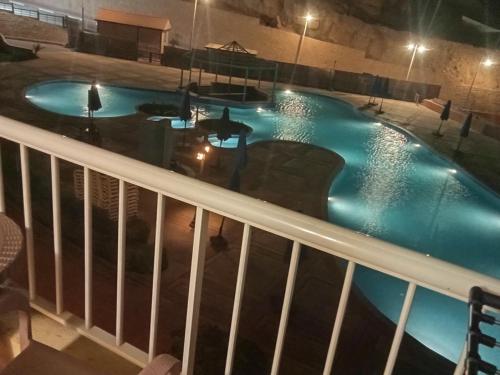 an overhead view of a swimming pool at night at بورتو السخنه in Ain Sokhna
