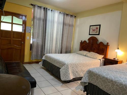Postel nebo postele na pokoji v ubytování Hotel-Villas JABEL TINAMIT