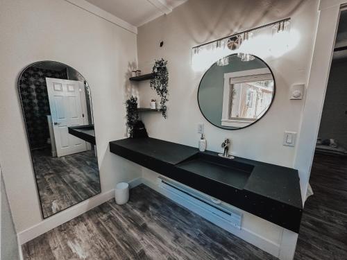 a bathroom with a sink and a mirror at Woody Mountain Bed & Breakfast in Flagstaff