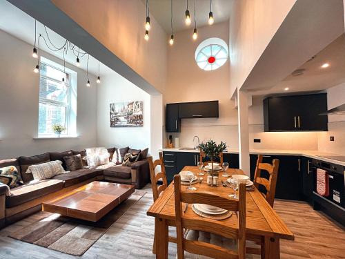 a living room with a couch and a table at The Beaumonts in Darlington