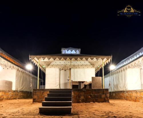 a building with stairs in front of it at night at NK Desert Camp Jaisalmer in Sām