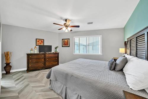 a bedroom with a bed and a ceiling fan at Crystal Village II 6B - Close to the Beach 2BD 2BA in Destin
