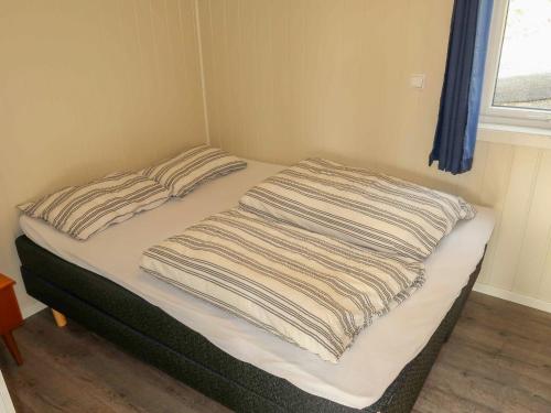 Ένα ή περισσότερα κρεβάτια σε δωμάτιο στο Holiday Home Havbris by Interhome