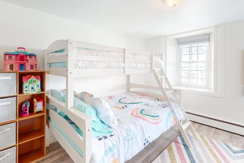 a white bunk bed in a childs bedroom at Riverside Retreat in Brockville