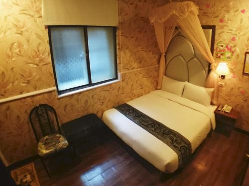 Giường trong phòng chung tại Fu Chia Hotel