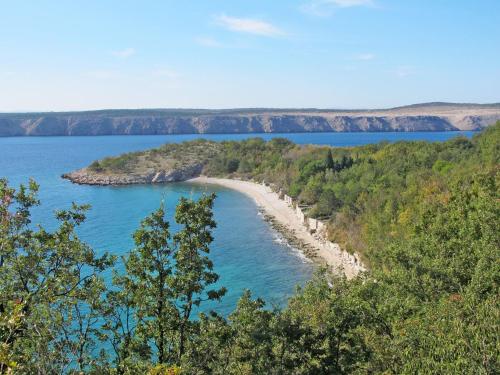 a beach in the middle of a body of water at Apartment Ivana by Interhome in Jadranovo