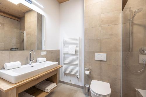a bathroom with a sink and a shower at Premium Tauernstyle Golling in Mariapfarr