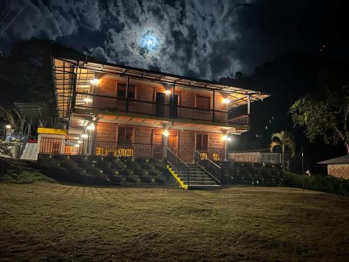 a building with stairs in front of it at night at HOTEL EMBRUJO CAMPESTRE in Jardin