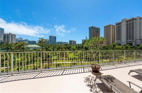 a balcony with a view of a city skyline at Soothing Hawaii Condo - 18F in Honolulu