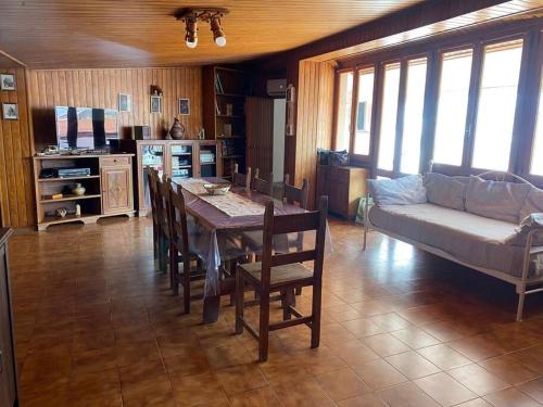 a living room with a table and a couch at "Domus Cannas"-Casa Indipendente- in Cagliari