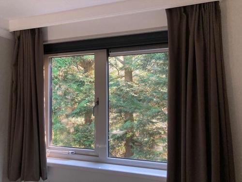 Φωτογραφία από το άλμπουμ του Luxe chalet met airco bij bos en zwemwater σε Hoevelaken