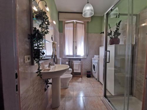 a bathroom with a sink and a toilet and a shower at B&B Ospedale Maggiore Parma affittacamere in Parma