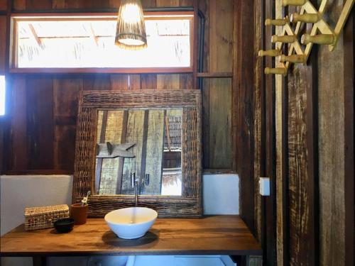 a bowl on a table in a room with a window at Divino Tatajuba eco-bungalow, beach kite front, amazing view! in Tatajuba