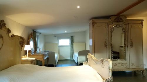 a bedroom with a bed and a dresser and a mirror at Ubytovani Sarka in Čistá