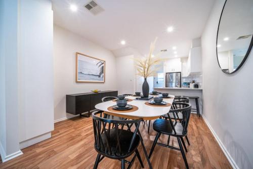 a kitchen and dining room with a table and chairs at Black Oak at Brompton in Bowden