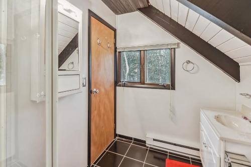 a bathroom with a shower and a sink at Poconos Chalet newly renovated, great location home in Tobyhanna