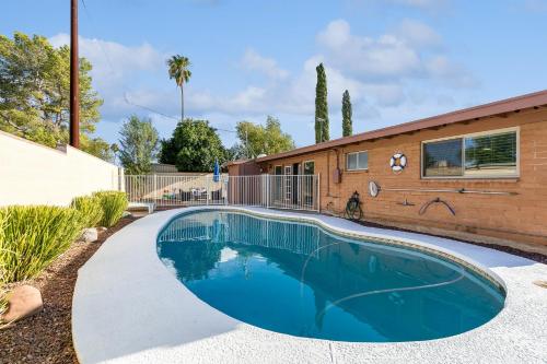 a swimming pool in front of a house at Four-Bedroom Holiday Home in Tucson