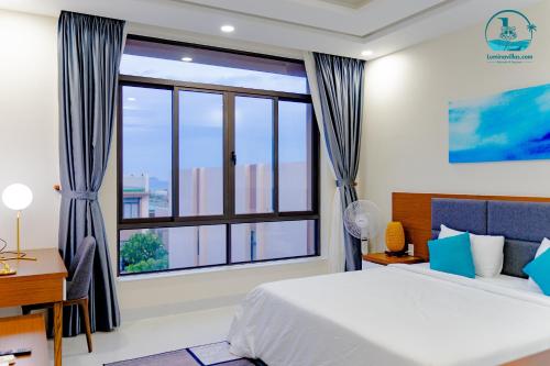 Кровать или кровати в номере Lumina Villas Cam Ranh, Bai Dai beach luxury resort villas