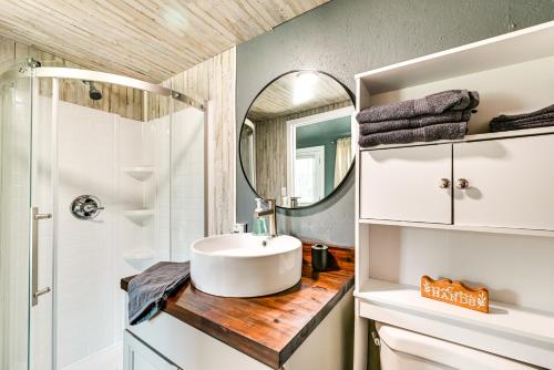 a bathroom with a sink and a shower at Brownsville Studio Cottage - Walk to Mammoth Cave! in Brownsville