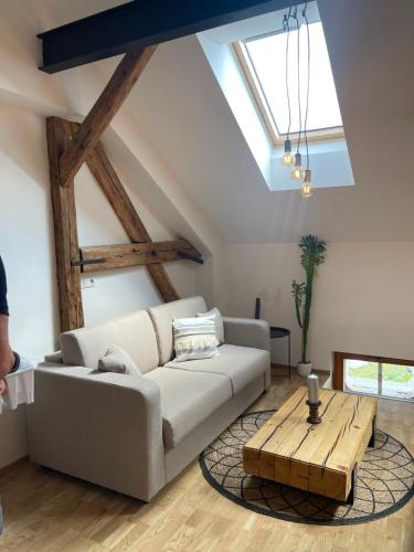 a living room with a couch and a table at Apartmány Marienhof in Znojmo