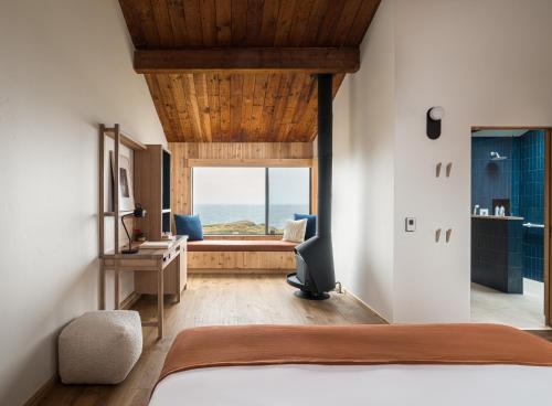 a bedroom with a bed and a view of the ocean at The Sea Ranch Lodge in Sea Ranch