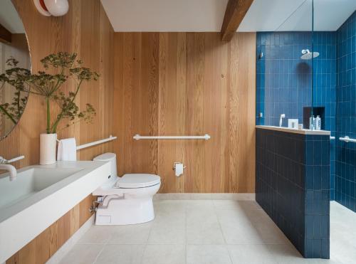 a bathroom with a toilet and a sink and a shower at The Sea Ranch Lodge in Sea Ranch
