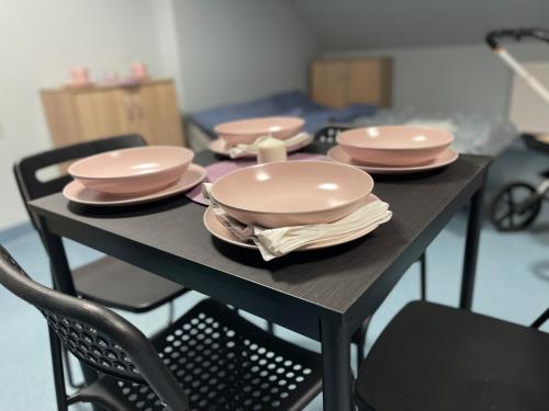 a table with plates and dishes on top of it at Lawendowa Przystań - Dolina Baryczy in Ujeździec Mały