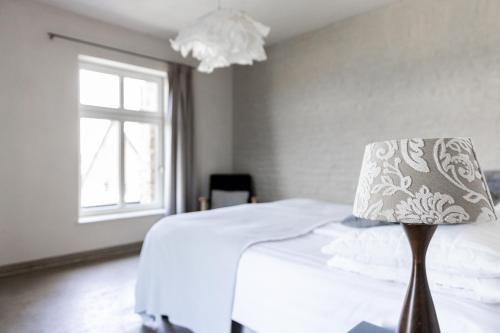 Cama o camas de una habitación en Domein Holset BruisendWijnHuis