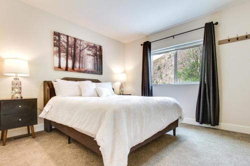 a bedroom with a large bed and a window at Riverfront Helena Retreat with Small Dock and Kayaks! in Helena