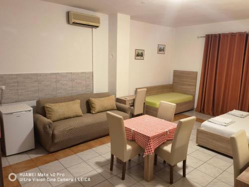 a living room with a couch and a table at Lovely Home City Center in Mostar