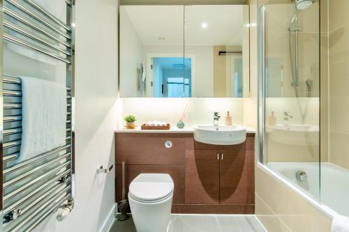 a bathroom with a toilet and a sink and a shower at Calm Zen Oasis, In Iconic London Olympic Park in London