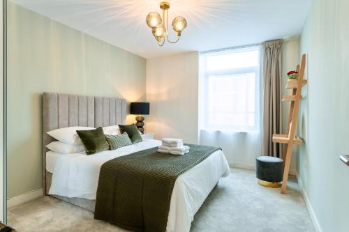 a bedroom with a large bed and a window at Calm Zen Oasis, In Iconic London Olympic Park in London