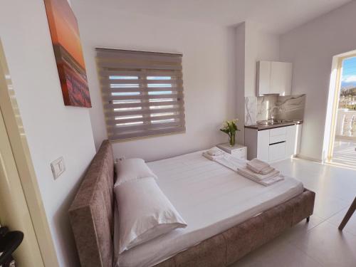 Un ou plusieurs lits dans un hébergement de l'établissement Villa Kanto (Holiday apartments and rooms)