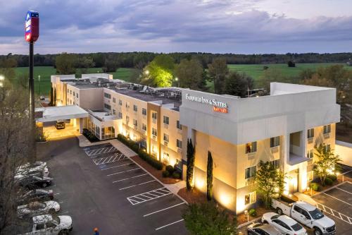 an aerial view of a hotel with a parking lot at Fairfield Inn by Marriott Lumberton in Lumberton