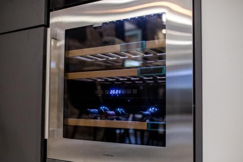 a stainless steel refrigerator with its door open at Villa Copun with heated pool in Rab