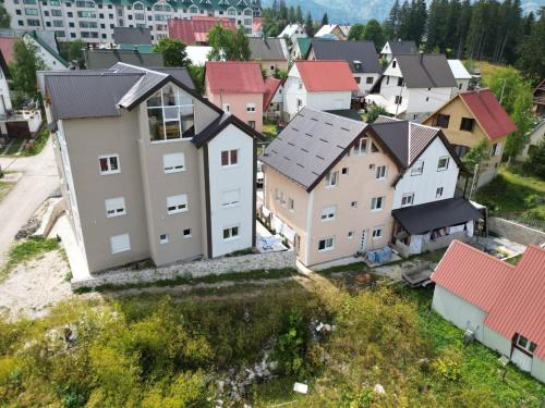an aerial view of a town with houses at Premium Apartments in Žabljak