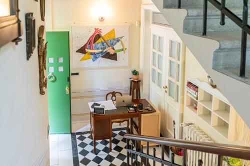 a staircase with a desk in a house at Villa Bonafata b&b in Trieste