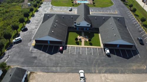 an overhead view of a large parking lot with a horse on it at Days Inn by Wyndham Savannah in Savannah