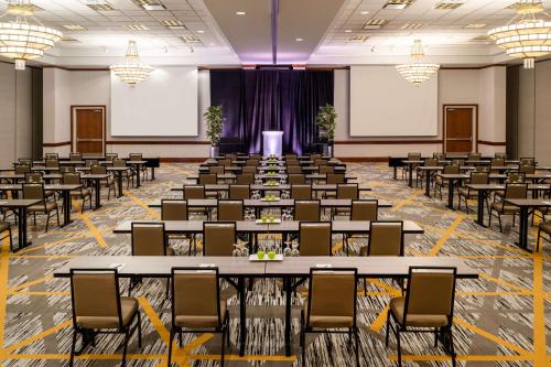 a large room with rows of tables and chairs at Embassy Suites by Hilton Portland Airport in Portland