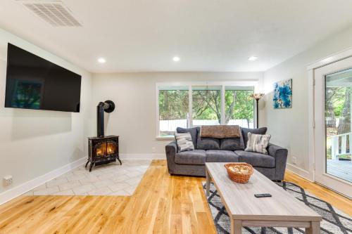 a living room with a couch and a fireplace at Twin Falls Vacation Rental with Yard Less Than 3 Mi to Town! in Twin Falls